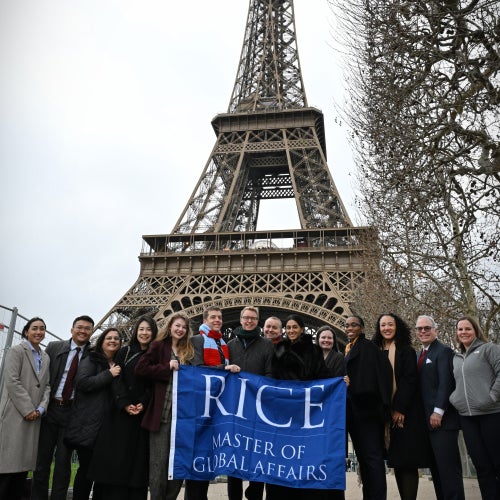 Students in front of the Eiffel Tower, Rice University Master of Global Affairs